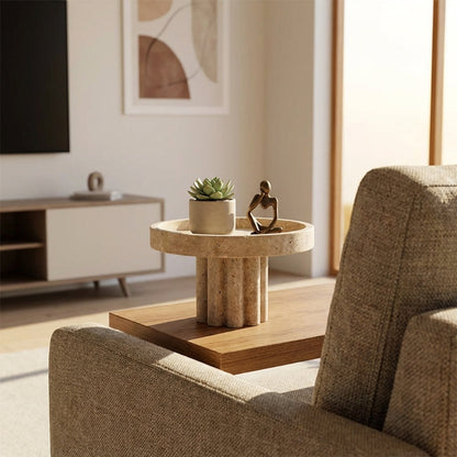 Living room with a textured coffee table, plant, and sculpture.