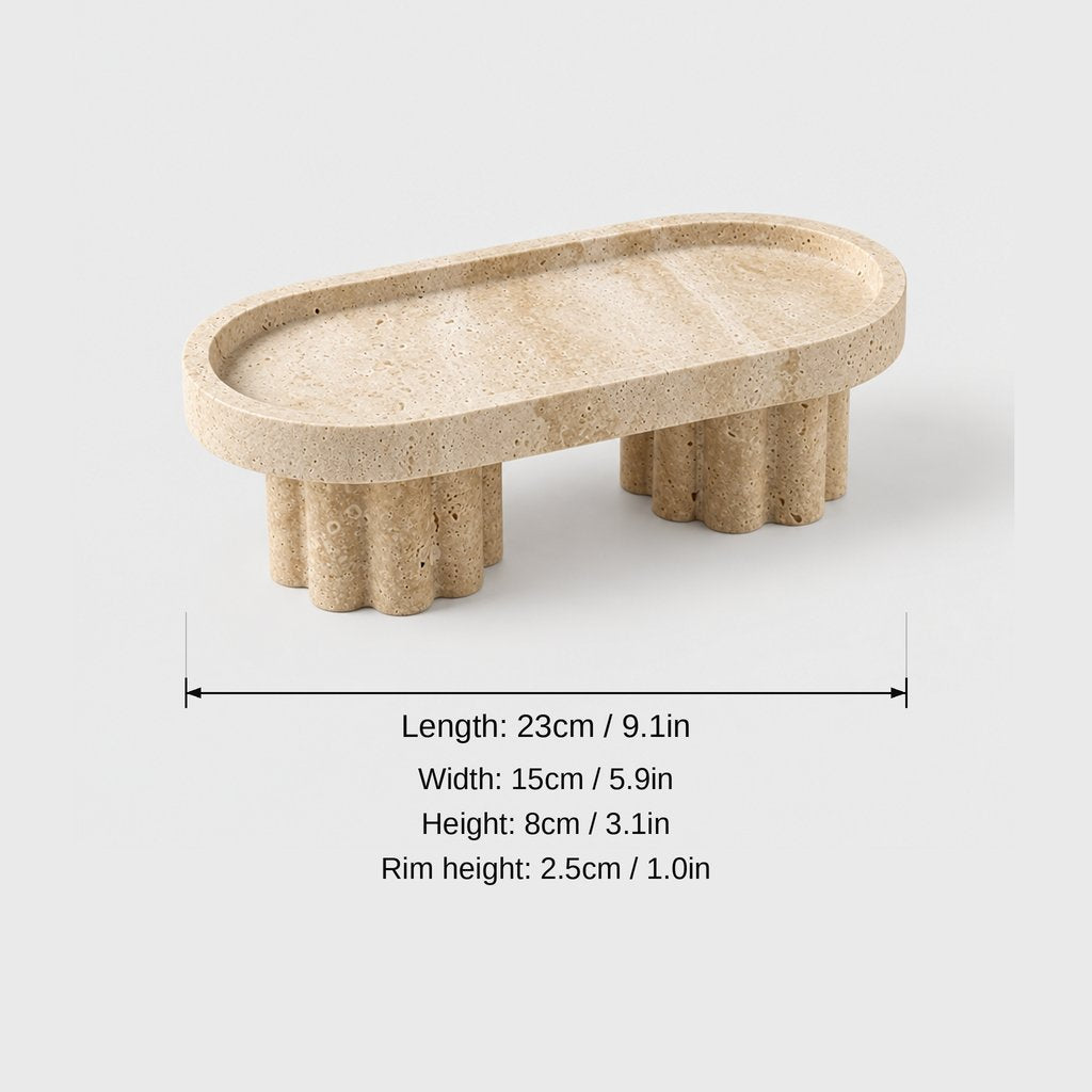 Oval pale beige pedestal tray on two fluted legs, dimensions graphic: length 23 cm or 9.1 in, width 15 cm or 5.9 in, height 8 cm or 3.1 in, rim height 2.5 cm or 1.0 in