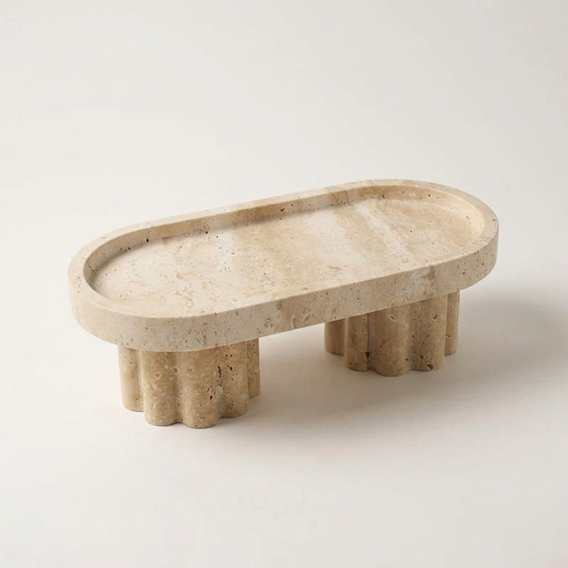 Beige stone tray with unique base design on a white background