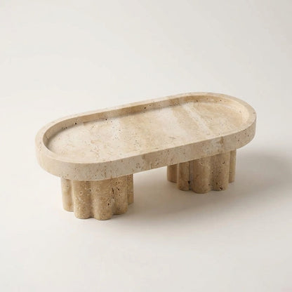 Beige stone tray with unique base design on a white background