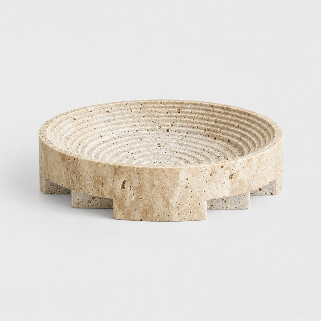 Round pale beige pedestal tray with a ridged dish and a notched base, on a plain light gray background