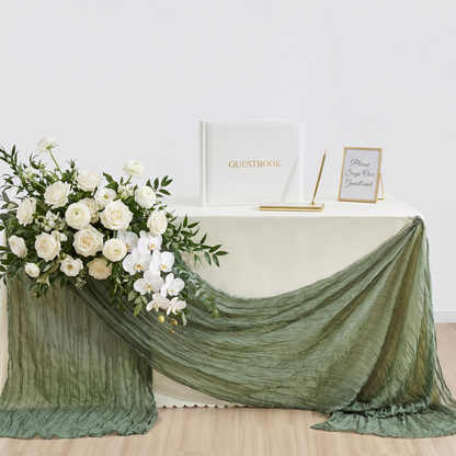 Sage green gauze table runner draped over the front of a table with florals, Kiyo Home 71-inch table runner