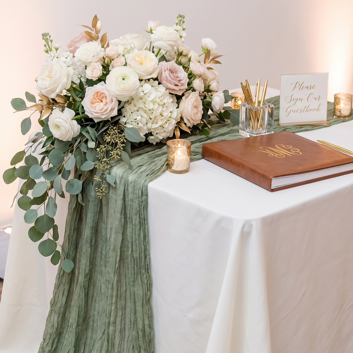 Sage green gauze table runner draped over a guestbook table with florals, Kiyo Home 71-inch table runner