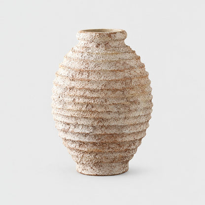 Large tall textured cream and tan vase with horizontal ridges and a narrow rim, on a plain light gray background
