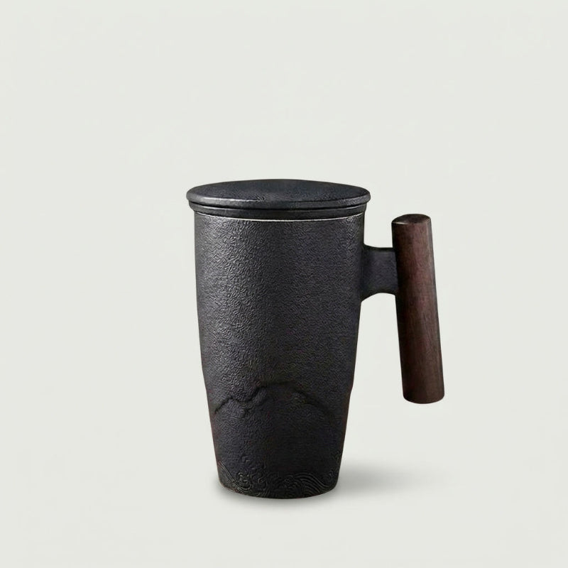 Thermal mug with wood handle pouring tea into cup