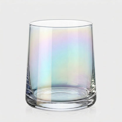 Single iridescent drinking glass with a soft rainbow sheen on a light gray background