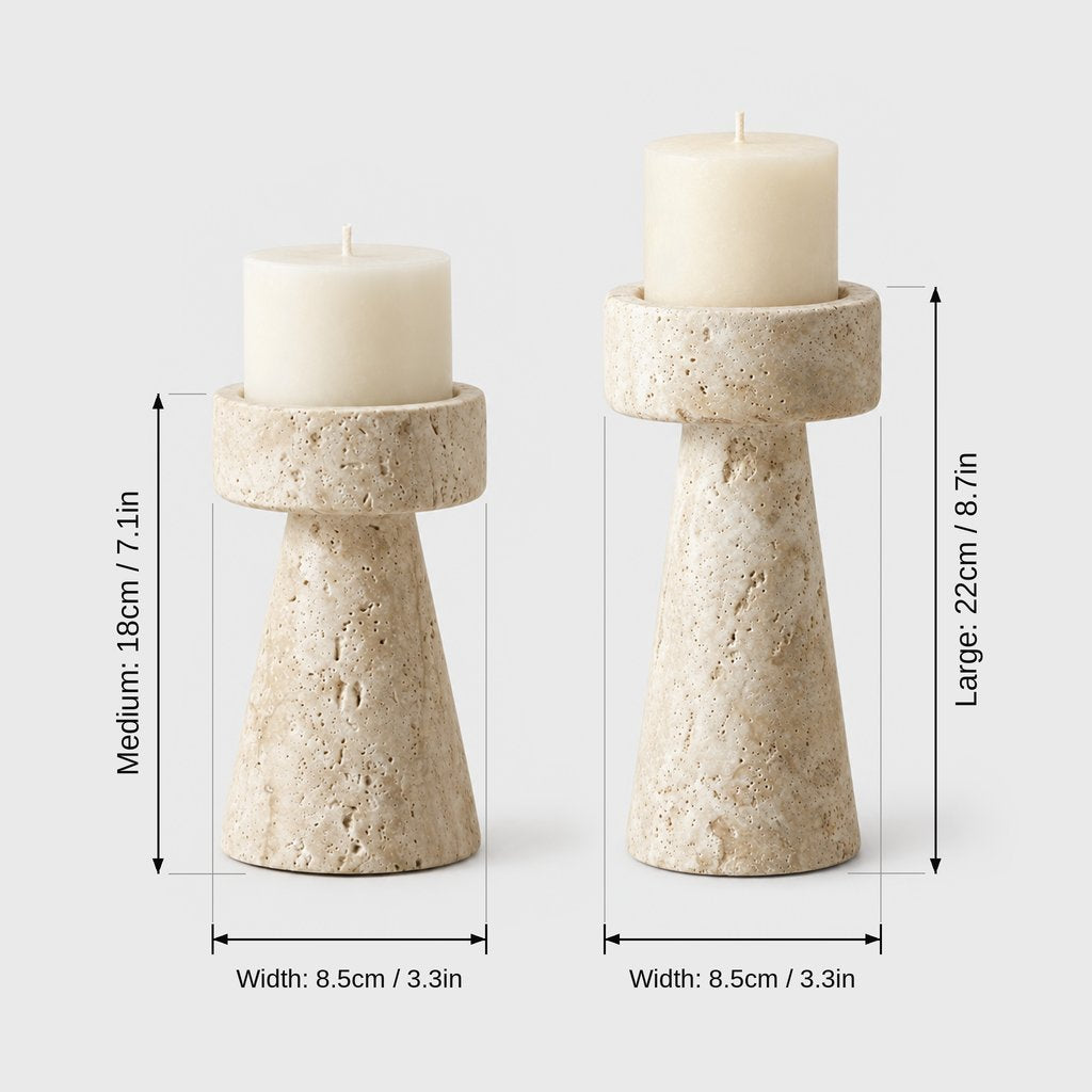 Medium and large travertine pillar candleholders with cream candles on a light grey background with dimensions labeled Medium 18 cm or 7.1 in, Large 22 cm or 8.7 in and Width 8.5 cm or 3.3 in for both