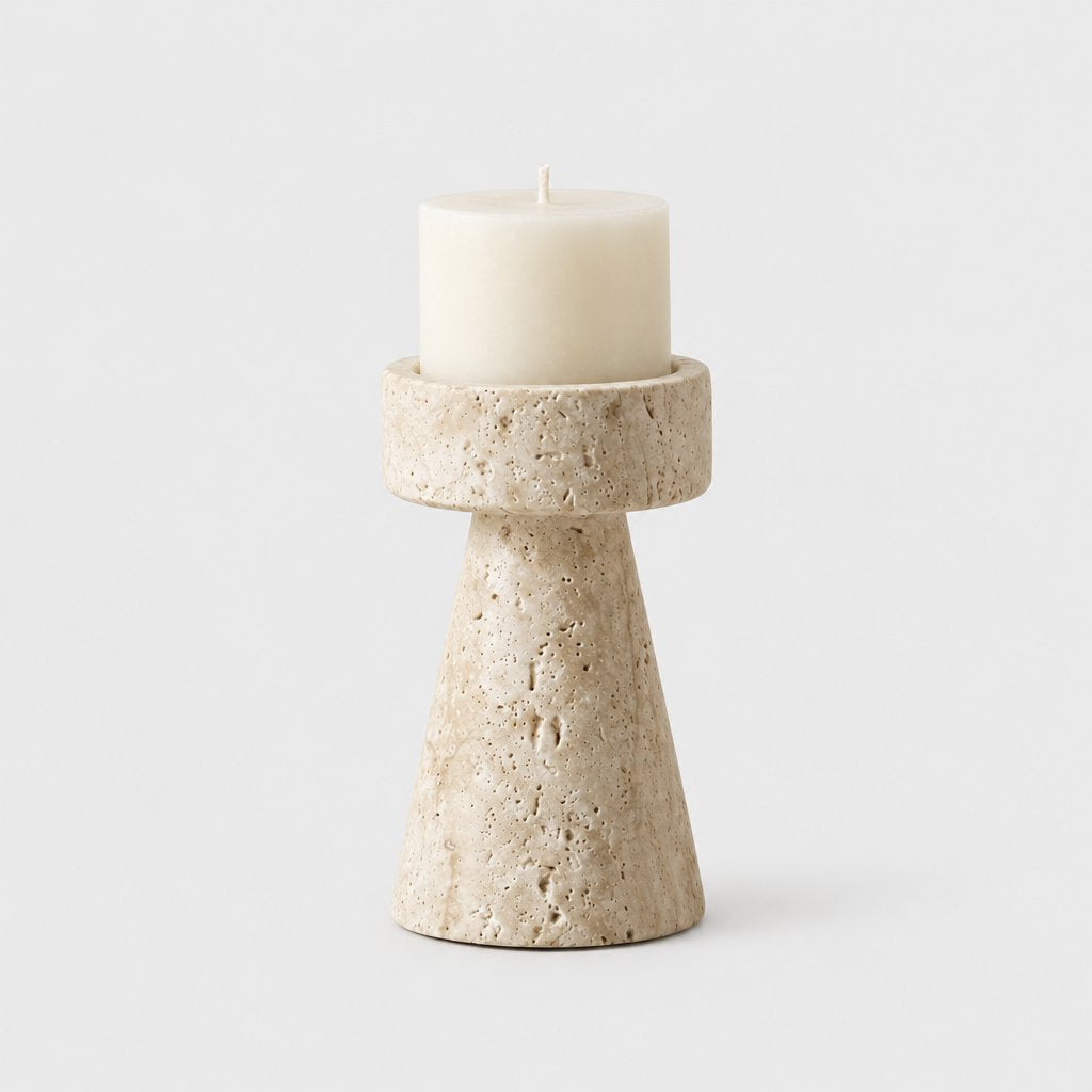 Medium cream travertine pillar candleholder with a cream pillar candle on a light grey background
