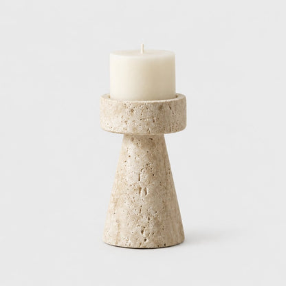 Medium cream travertine pillar candleholder with a cream pillar candle on a light grey background