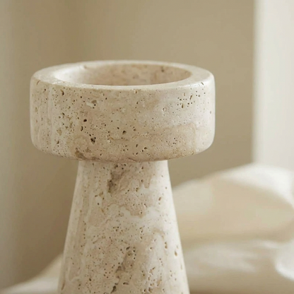 Beige stone candle holder on a neutral background