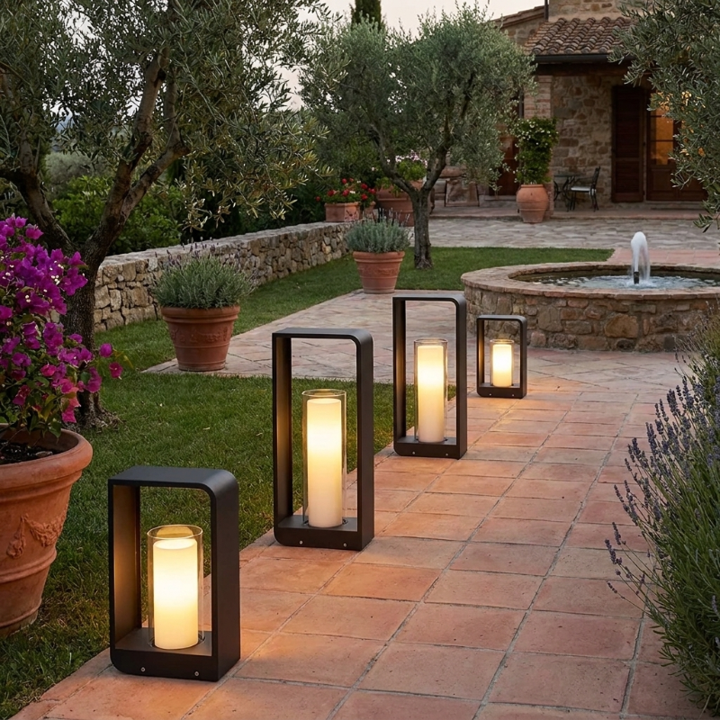Twilight outdoor solar lanterns lining terracotta garden path at dusk