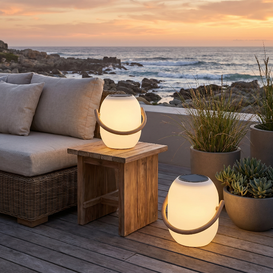 SunLume outdoor solar lantern on outdoor side table by ocean view