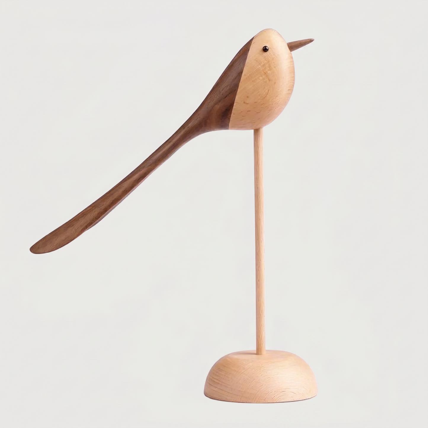 Two-Tone Wood Bird Sculpture hero shot in walnut and beech wood on a thin dowel and round base against a clean off-white background