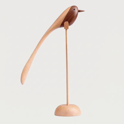 Two-Tone Wood Bird Sculpture hero shot with a lighter wood grain on a thin dowel and round base against a clean off-white background