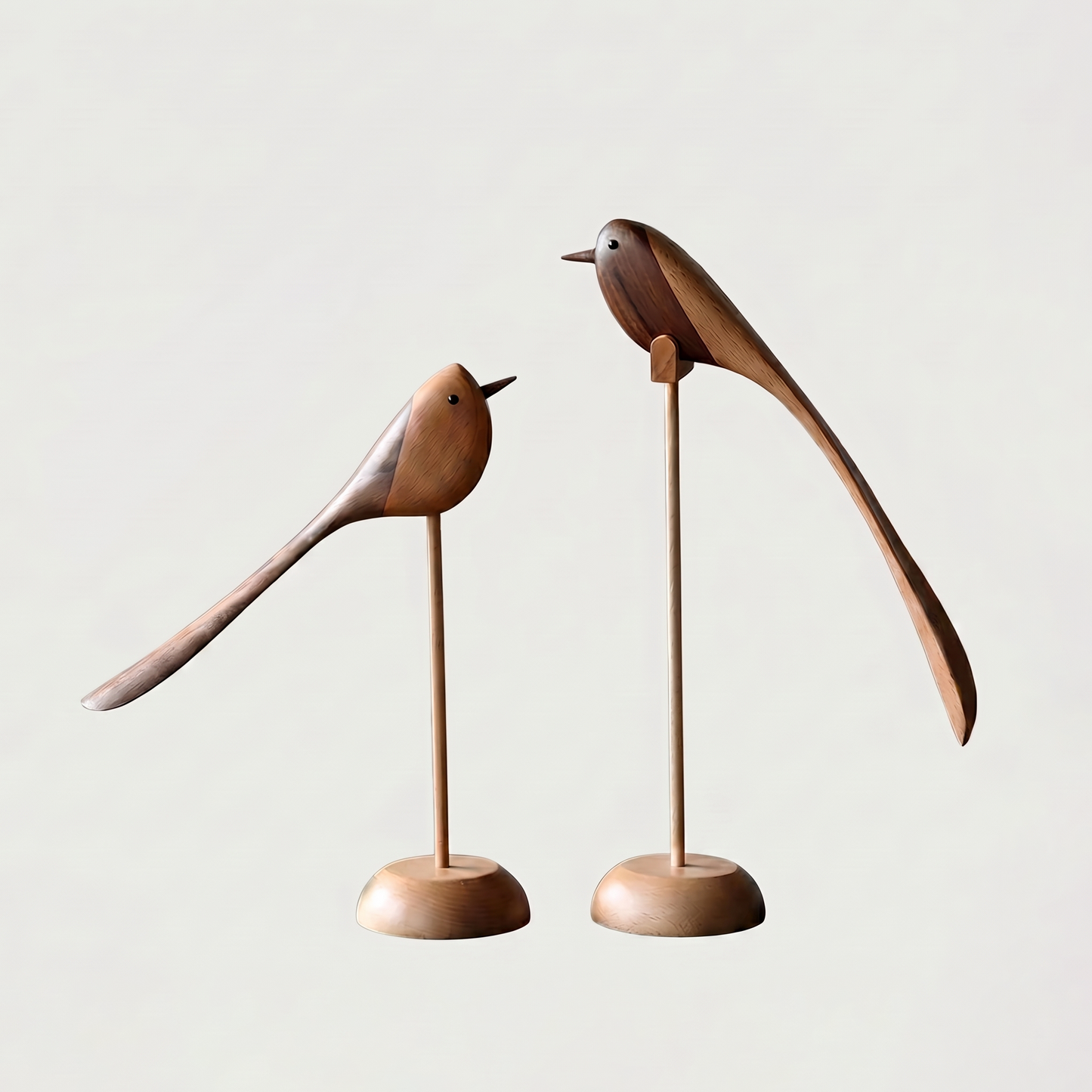 Two-Tone Wood Bird Sculptures shown in both small and large sizes together on an off-white background