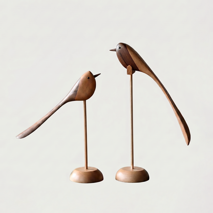 Two-Tone Wood Bird Sculptures shown in both small and large sizes together on an off-white background