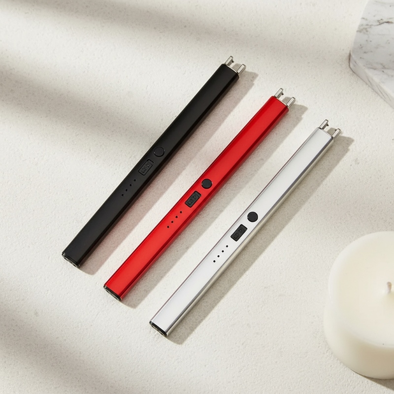 Three electronic devices in black, red, and silver on a light surface.