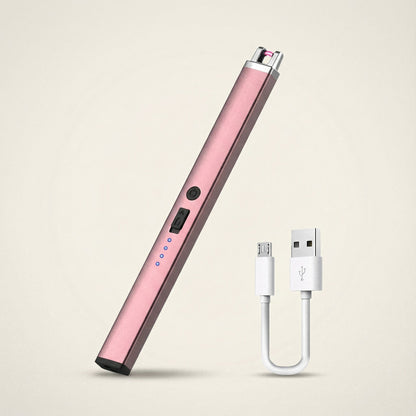 Pink electronic device with USB cable on a beige background