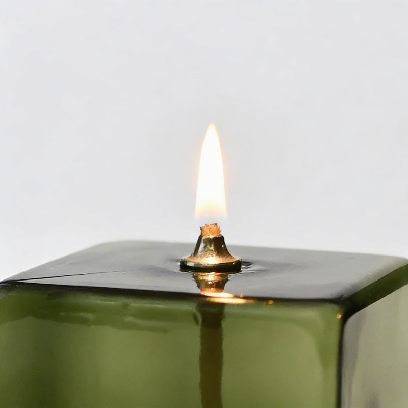 Vintage green glass oil lamp close-up
