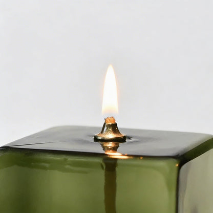 Vintage green glass oil lamp close-up