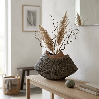 Brown WabiSabi Ceramic Vase filled with pampas grass and branches on a console table in an entryway