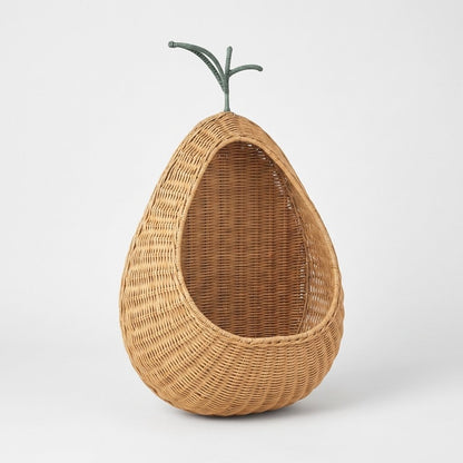 Pear-shaped handwoven rattan wall-mounted fruit storage basket on a white background