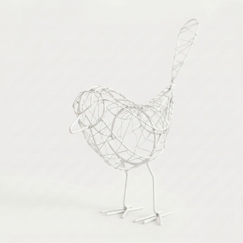 Iron bird sculpture on white background facing left