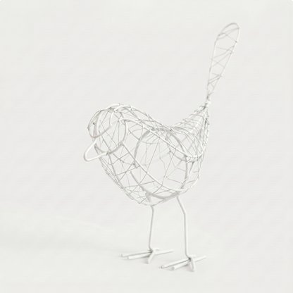 Iron bird sculpture on white background facing left