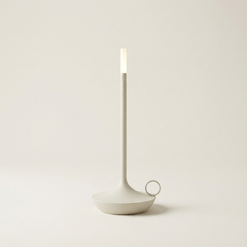 Minimalist candle holder with a candle on a plain background