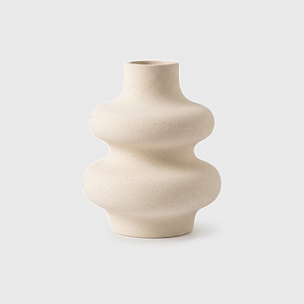 Medium cream rippled ceramic vase on a plain light background