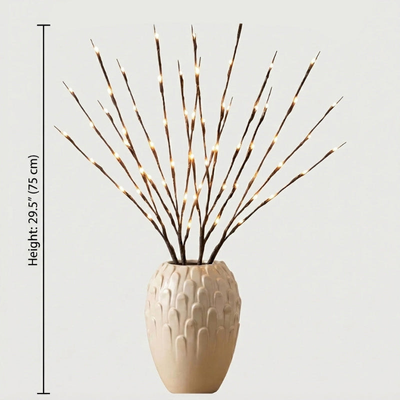 Willow branch LED lights in beige vase on white background