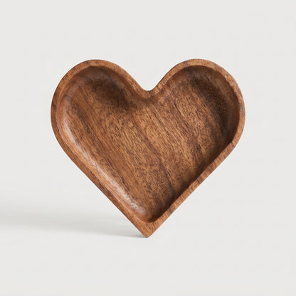 Wood heart-shaped dish on white background