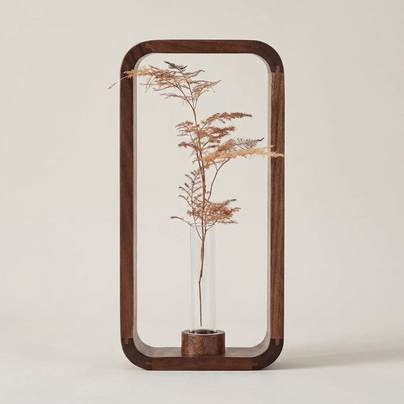 Decorative wooden frame with a plant inside on a plain background