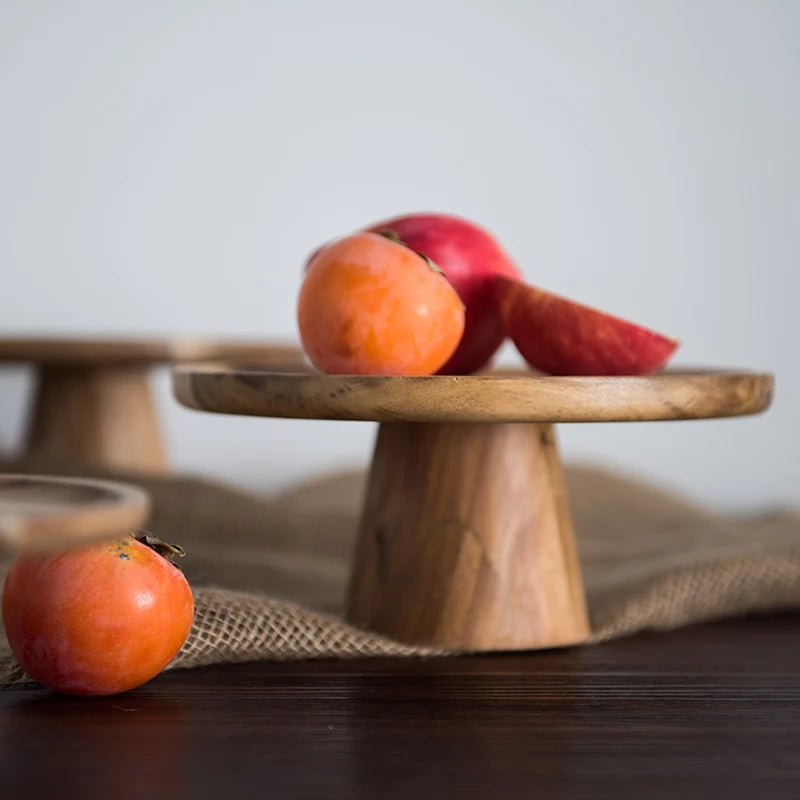 Wooden Cake Stand beautifully styled with fresh pastries and greenery on a dining table, adding a warm, rustic touch to the decor.