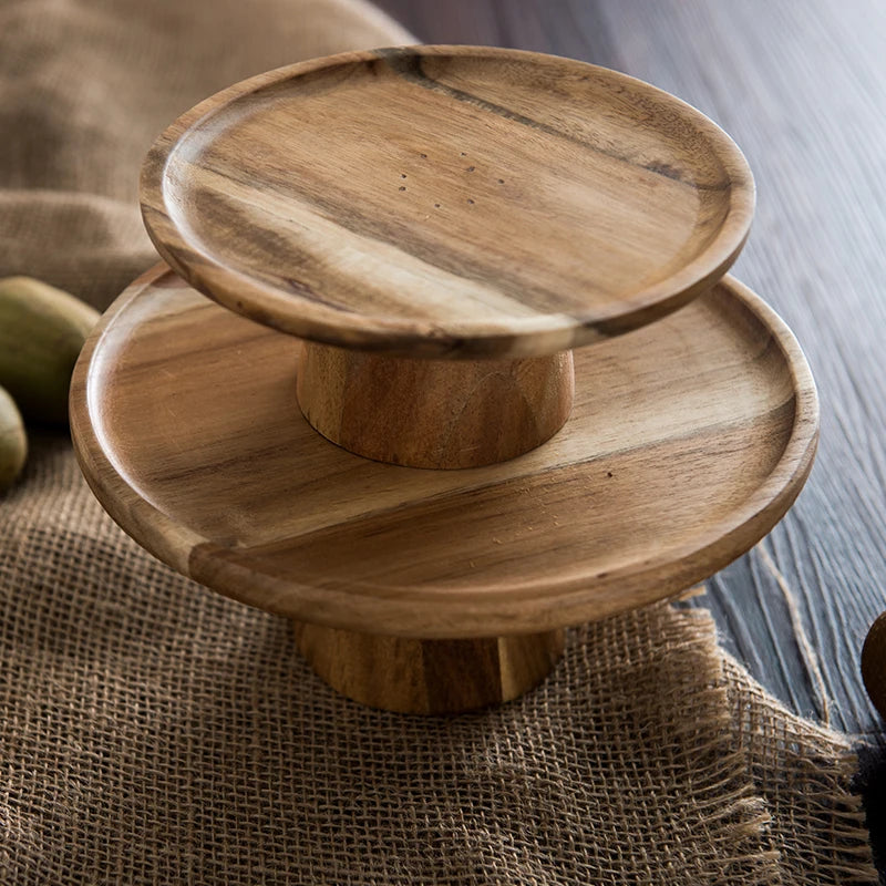 Side-by-side view of the Wooden Cake Stand in two sizes: small (16.5 x 7.2 cm) and large (21.7 x 8.5 cm), highlighting their versatility