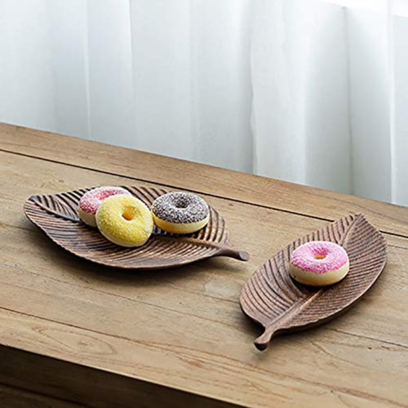 Wooden Leaf Tray with a selection of desserts – A styled tray holding a variety of desserts, showcasing the tray’s function as a stylish food serving piece.