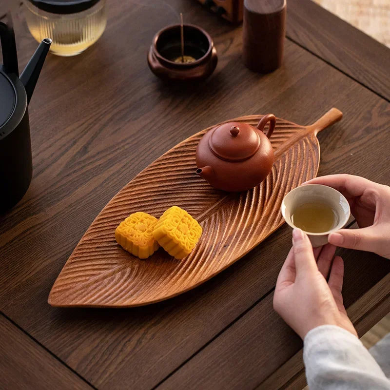 Serving food on Walnut Leaf Tea Tray – Wooden tray used to serve food and decorative items, highlighting its versatility.