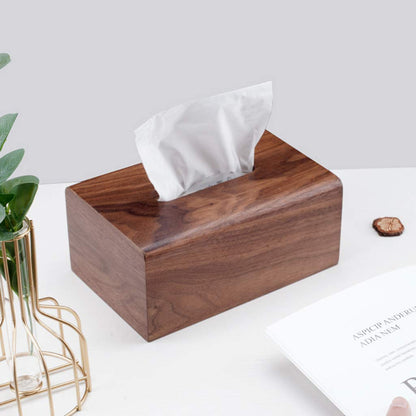 Wooden tissue box with a sleek, natural finish placed on a coffee table, adding warmth to the modern living room.