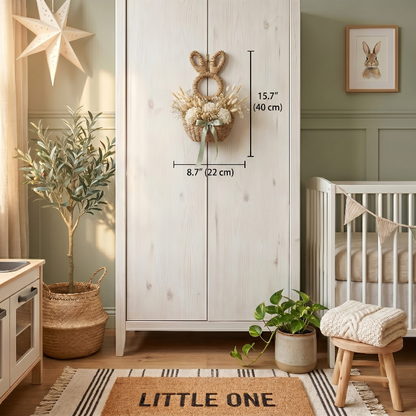 Woven bunny wall basket hanging in nursery above crib