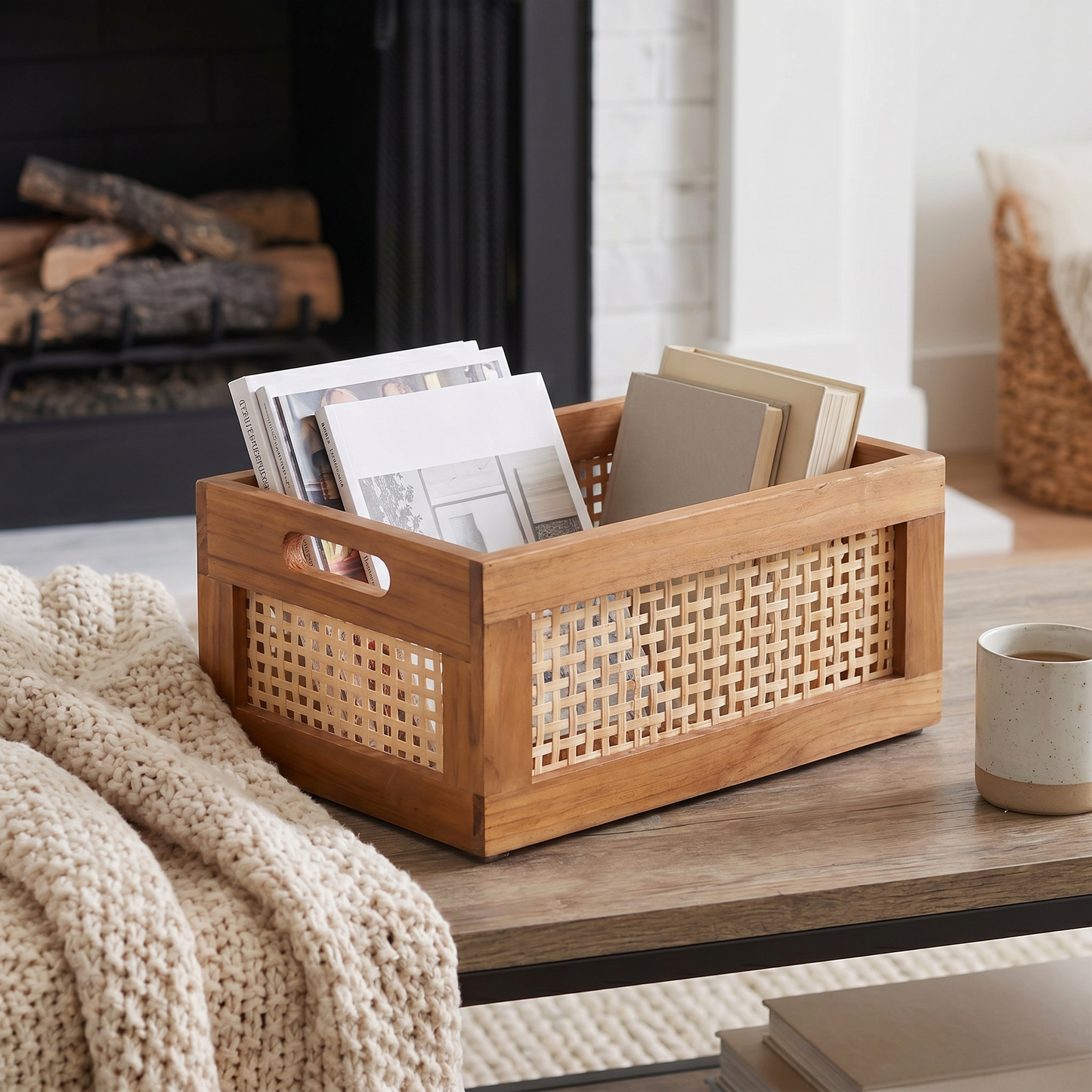 Woven Rattan Storage Basket styled in a living room holding blankets, with bamboo accents and a solid wood base