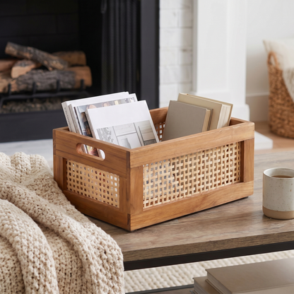 Woven Rattan Storage Basket styled in a living room holding blankets, with bamboo accents and a solid wood base