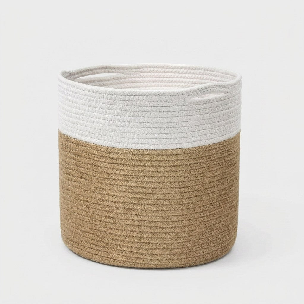 Woven Storage Basket in white and tan two-tone cotton rope with handles, angled view on a light grey background