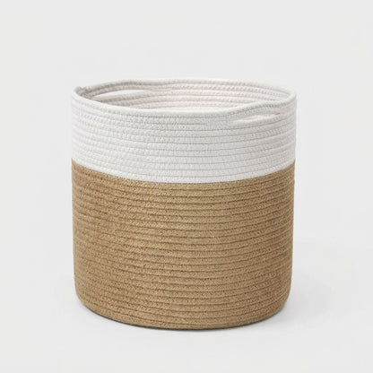 Woven Storage Basket in white and tan two-tone cotton rope with handles, angled view on a light grey background
