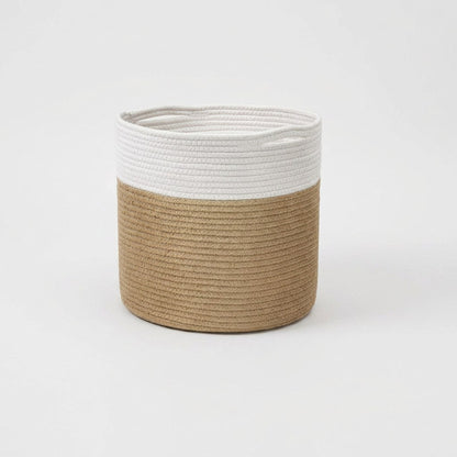 Woven Storage Basket in white and tan two-tone cotton rope with handles, front view on a clean off-white background
