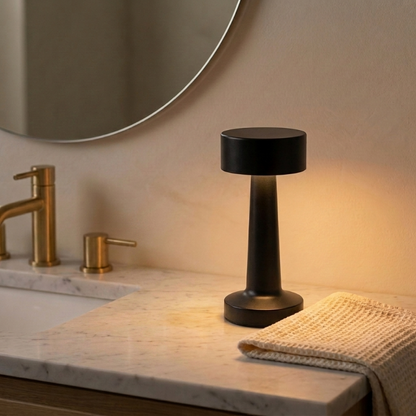 Zain cordless rechargeable table lamp in black on bathroom counter