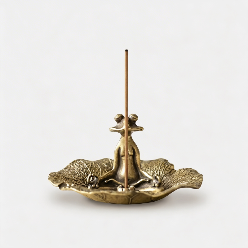 Zen frog incense holder on white background with incense stick