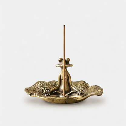 Zen frog incense holder on white background with incense stick